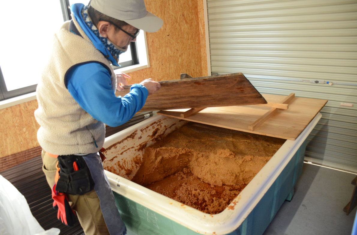 One of the many containers holding fermenting miso paste